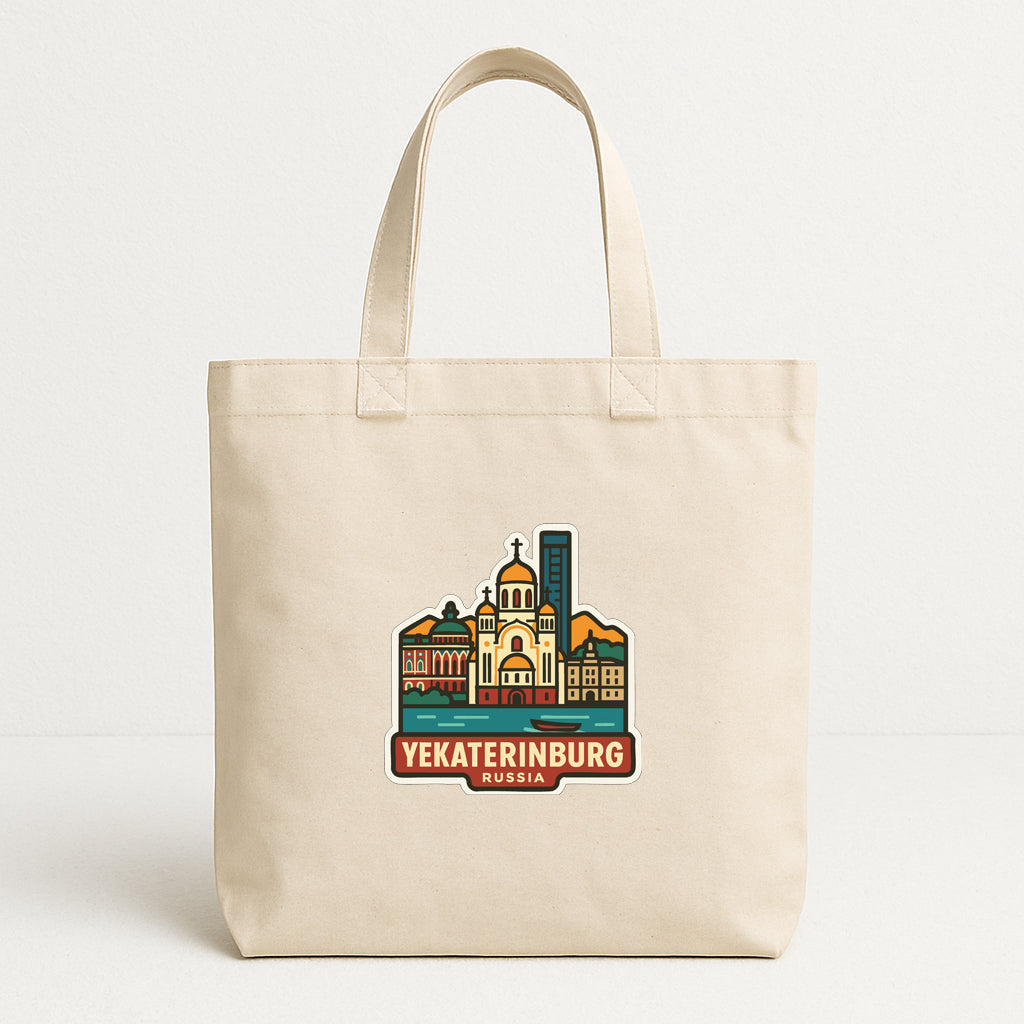 A beige tote bag with a colorful graphic of the city of Yekaterinburg, Russia, printed on it.