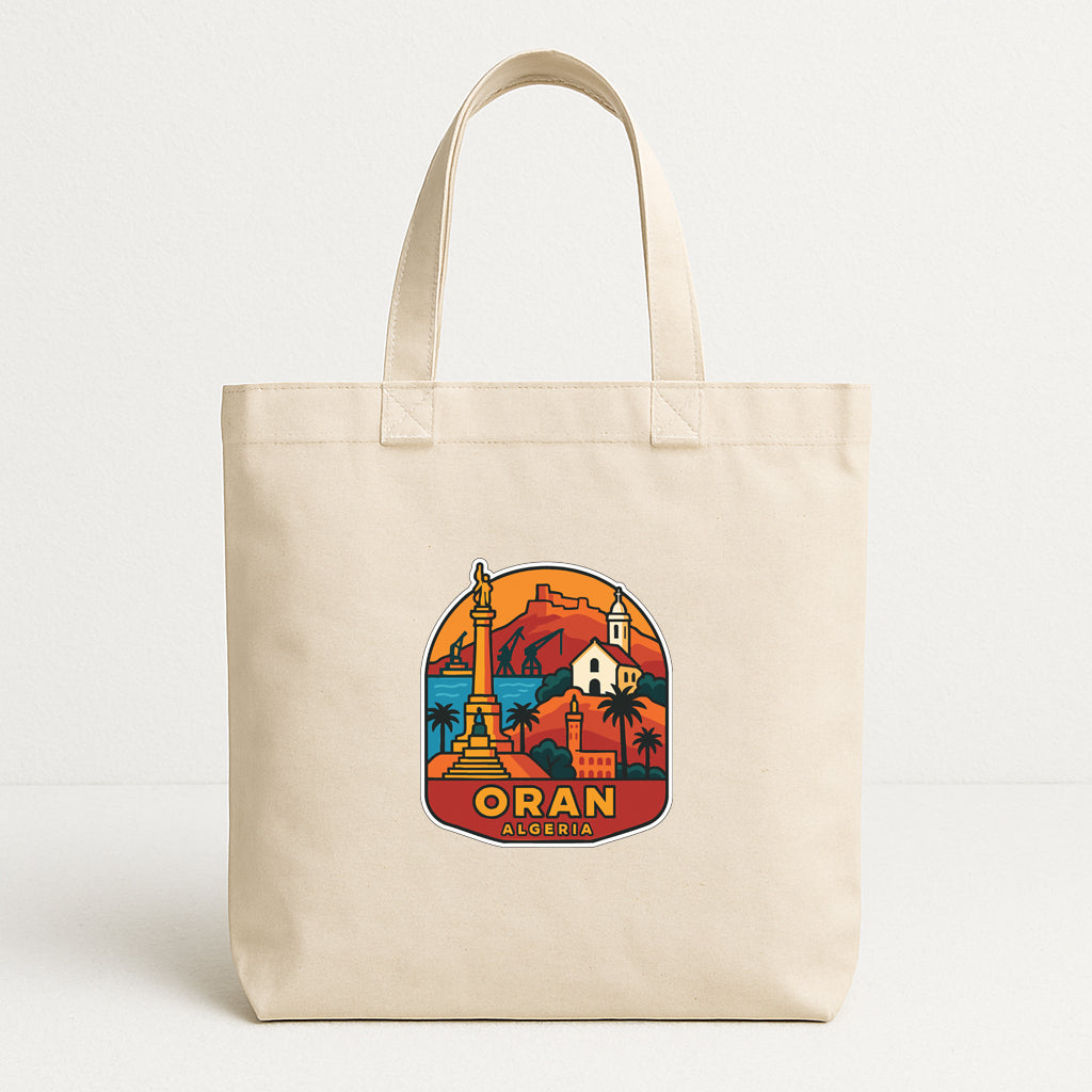 A beige tote bag with a colorful graphic design depicting a cityscape and landmarks, including a tall tower and a church.