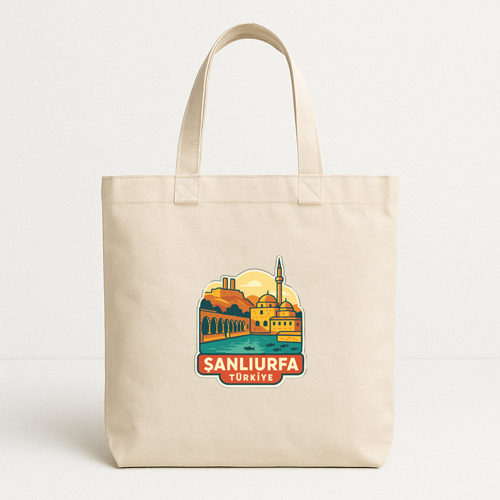 A beige tote bag with a printed design depicting a cityscape and the text "SANLIURFA TURKISE" printed on it.
