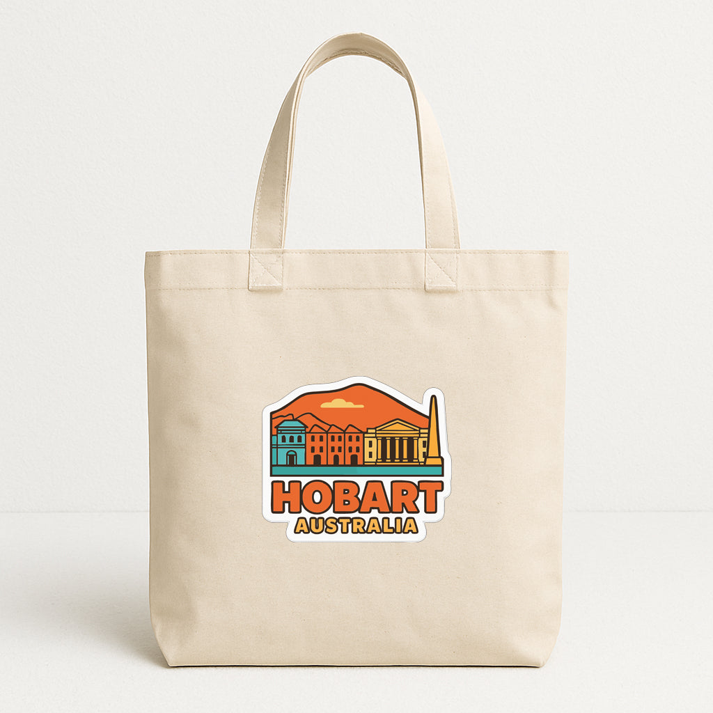 A beige tote bag with a graphic design featuring a cityscape and the text "HOBART AUSTRALIA" printed on it.