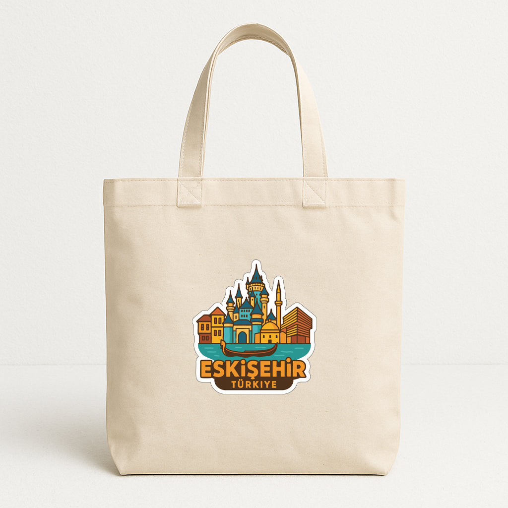 A beige tote bag with a colorful graphic of a cityscape and the text "ESKISEHIR TURKISHYE" printed on it.