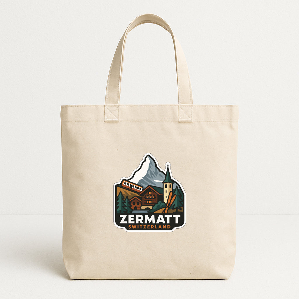 A beige tote bag with a printed logo depicting a mountain landscape and a Swiss chalet.