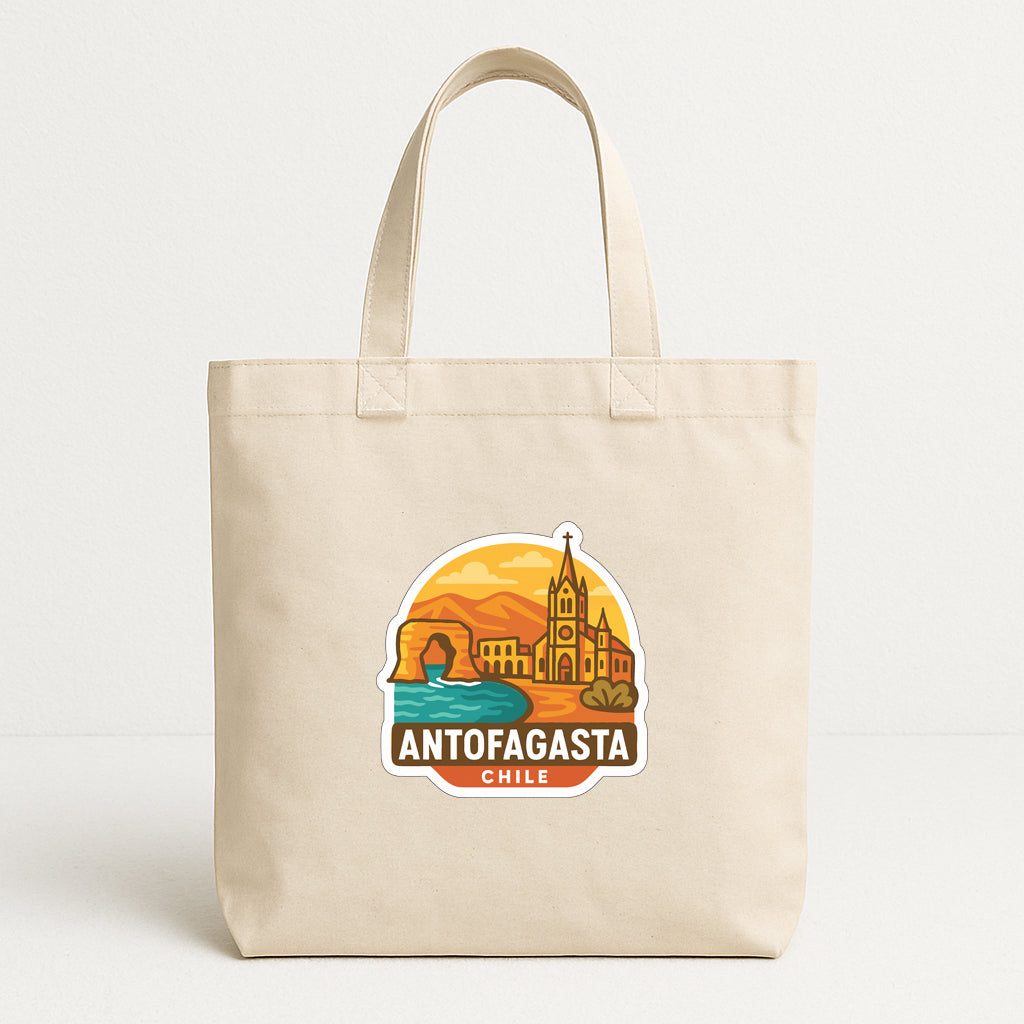 A beige tote bag with a graphic design featuring a cityscape and the text "ANTOFAGASTA CHILE".