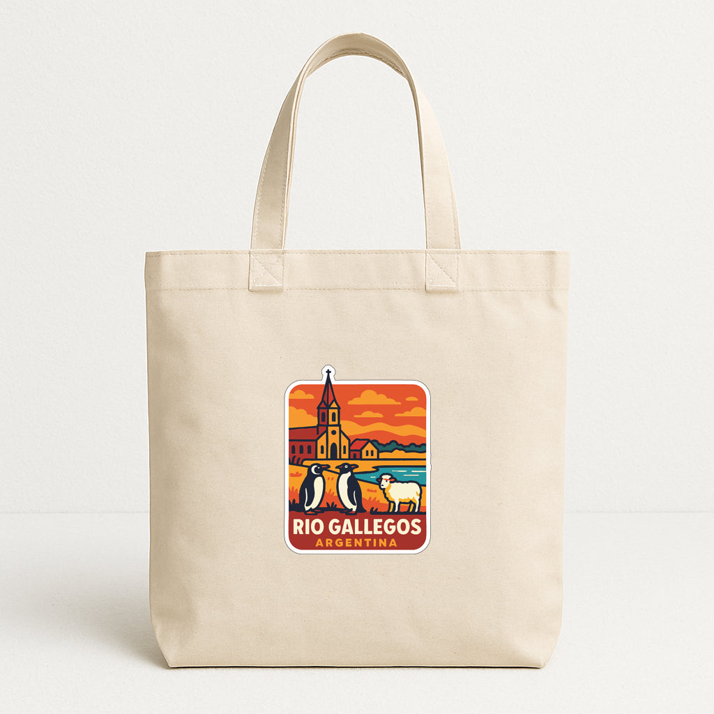 A beige tote bag with a graphic design featuring a cityscape and a penguin, along with the text "Rio Gallegos Argentina".