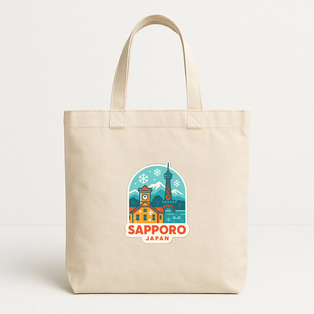 A beige tote bag with a printed design depicting the Sapporo, Japan, landmark.