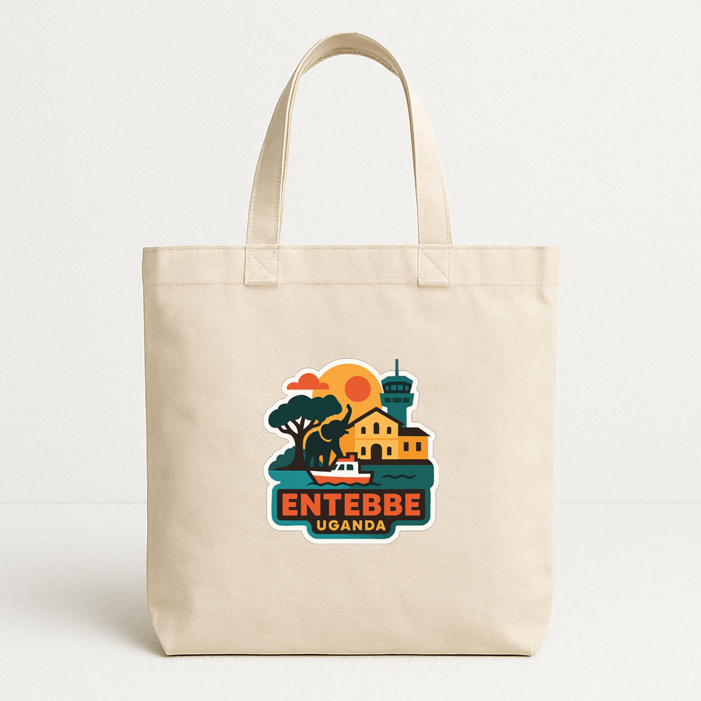 A beige tote bag with a colorful graphic depicting a scenic view of Entebbe, Uganda.