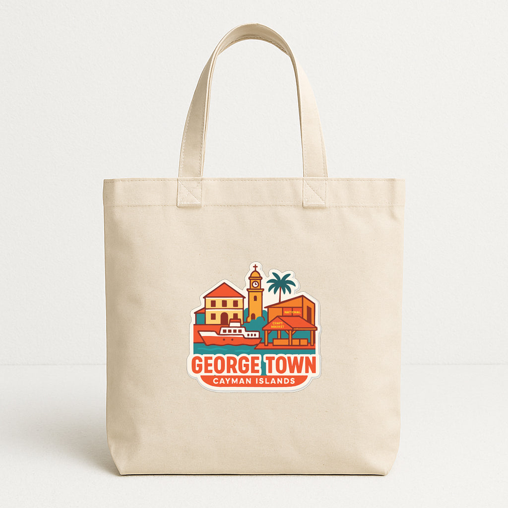 A beige tote bag with a printed design depicting a tropical island scene, including a clock tower, buildings, and palm trees.