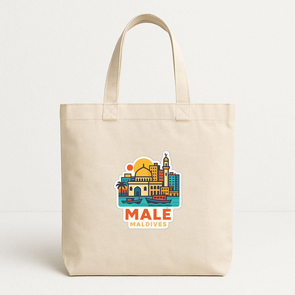 A beige tote bag with a colorful graphic design depicting a city skyline and the text "MALÉ MALDIVES" printed on it.