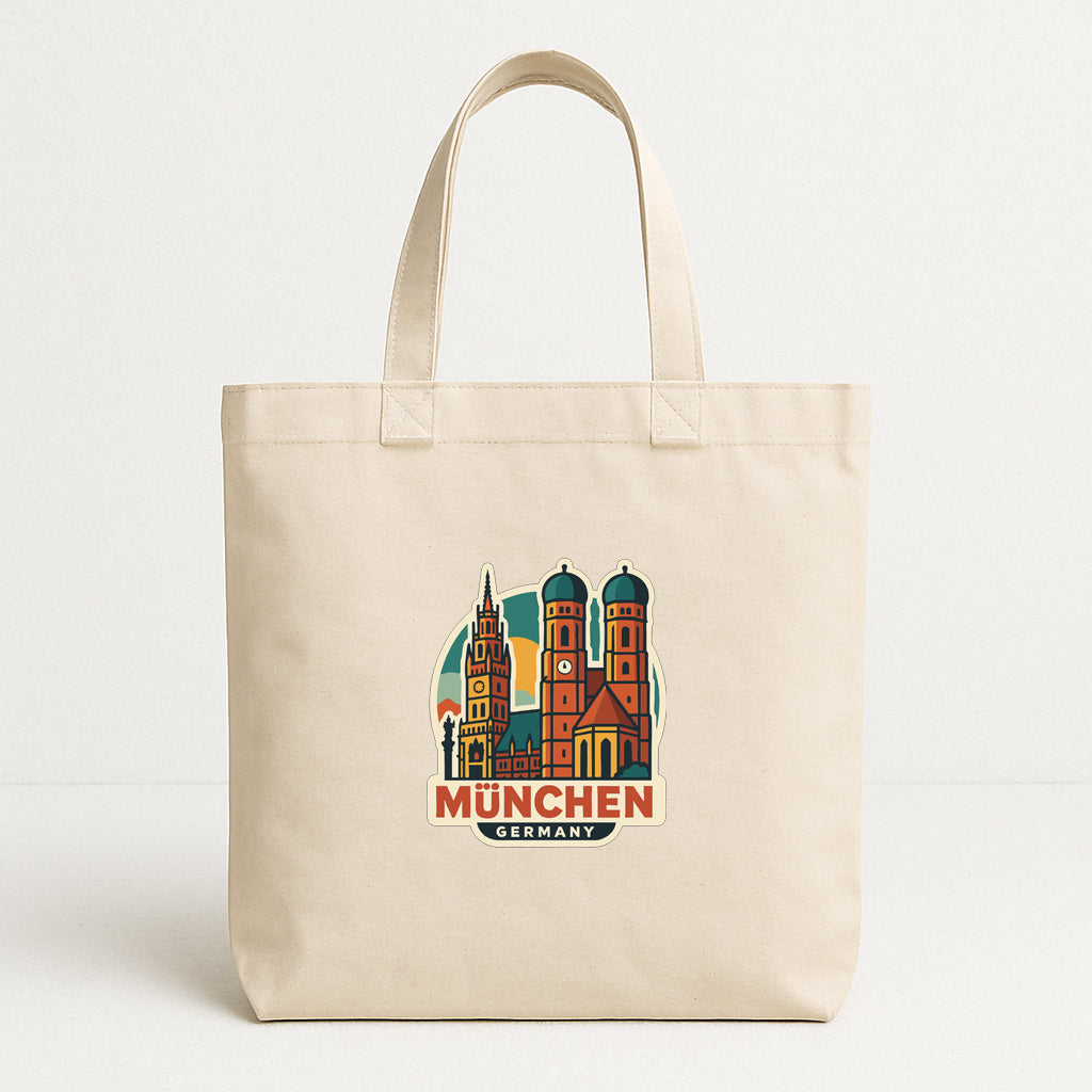 A beige tote bag with a graphic of the Munich Cathedral and the text "München, Germany" printed on it.