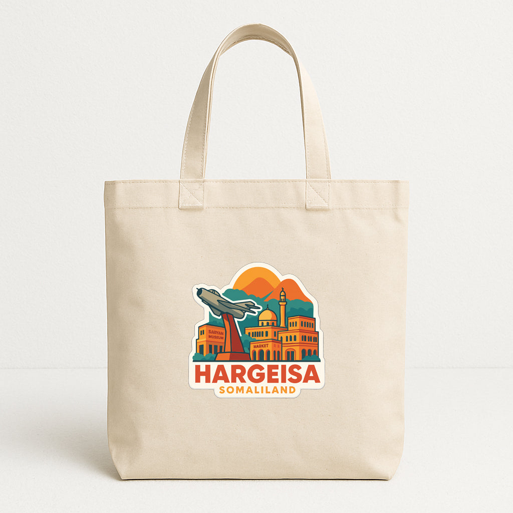 A beige tote bag with a printed design depicting a city skyline and the text "Hargeisa Somaliland" printed on it.