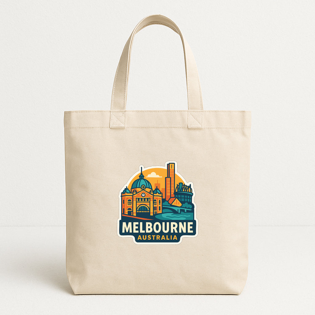 A beige tote bag with a graphic design depicting the Melbourne, Australia skyline, featuring iconic landmarks and buildings.