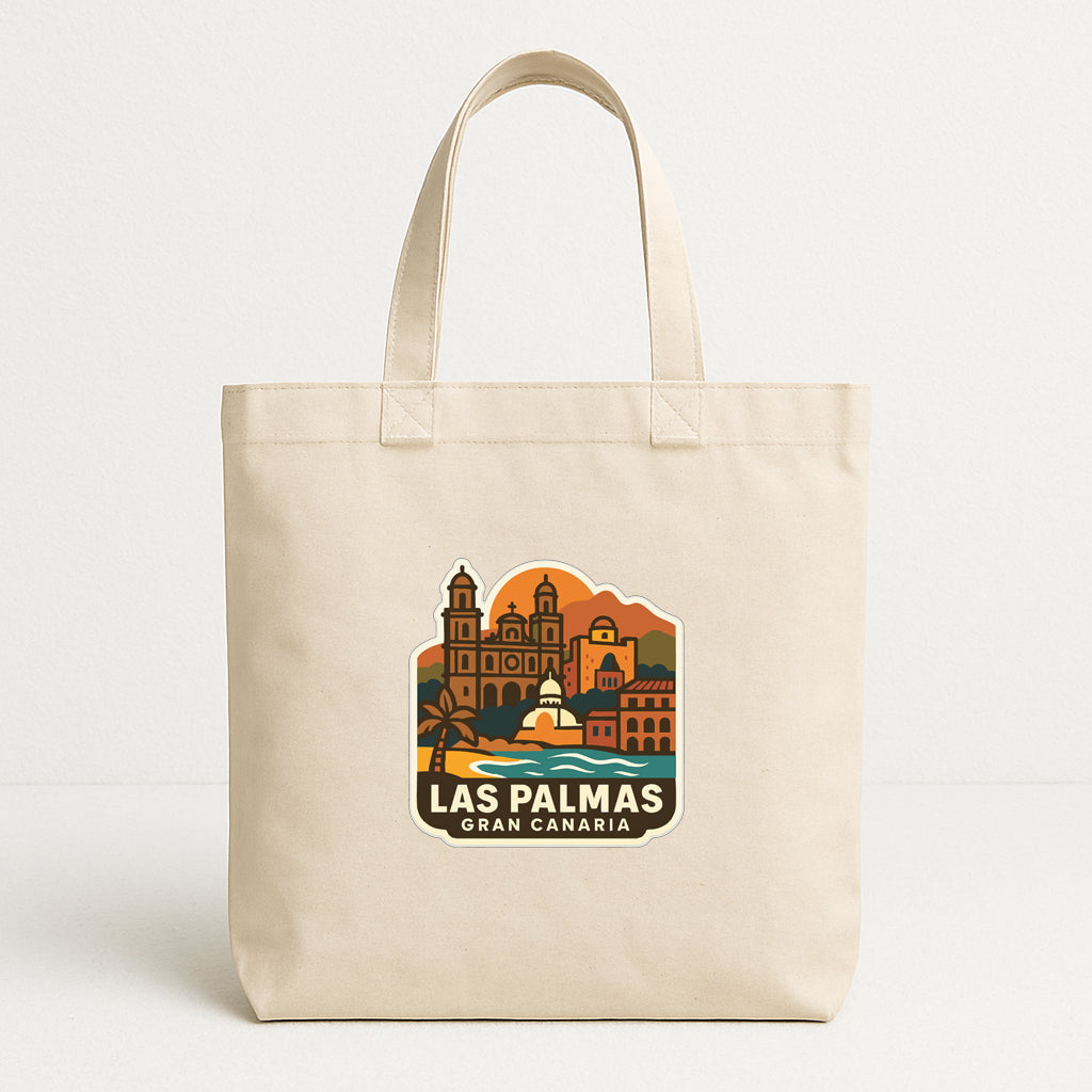 A beige tote bag with a graphic design featuring the city of Las Palmas, Gran Canaria, and the surrounding landscape.