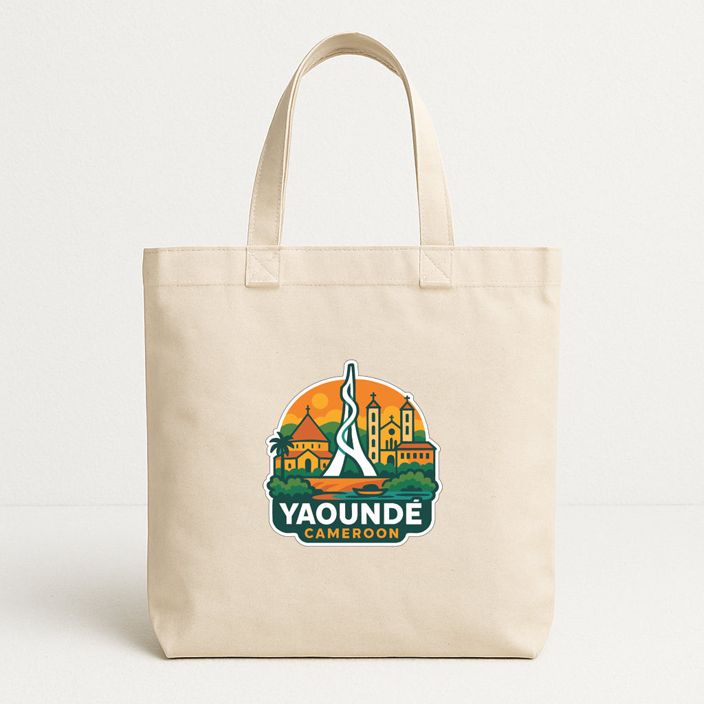 A beige tote bag with a graphic design featuring a city skyline and the text "Yaounde Cameroon" printed on it.