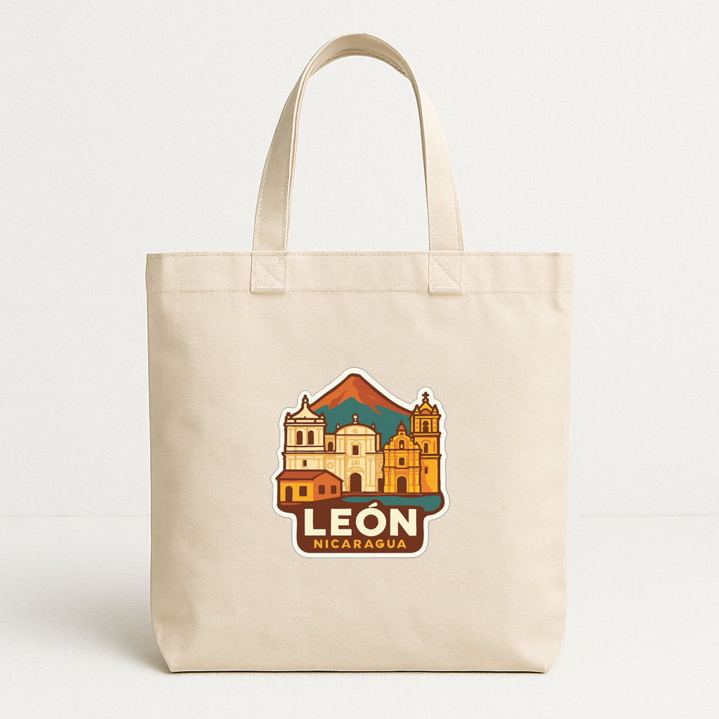 A beige tote bag with a printed design of a cityscape and the text "LEON NICARAGUA" printed on it.