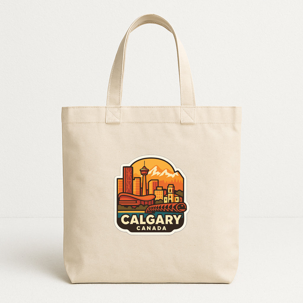 A beige tote bag with a printed design depicting the city of Calgary, Canada.