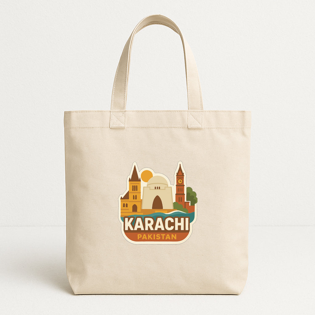 A beige tote bag with a graphic design featuring the city of Karachi, Pakistan.