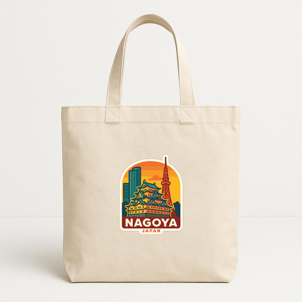 A beige tote bag with a printed sticker depicting the Nagoya skyline in Japan.