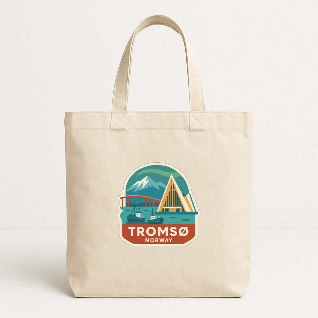 A beige tote bag with a graphic design depicting a scenic view of a bridge, mountains, and a boat, along with the text "TROMSO NORWAY".
