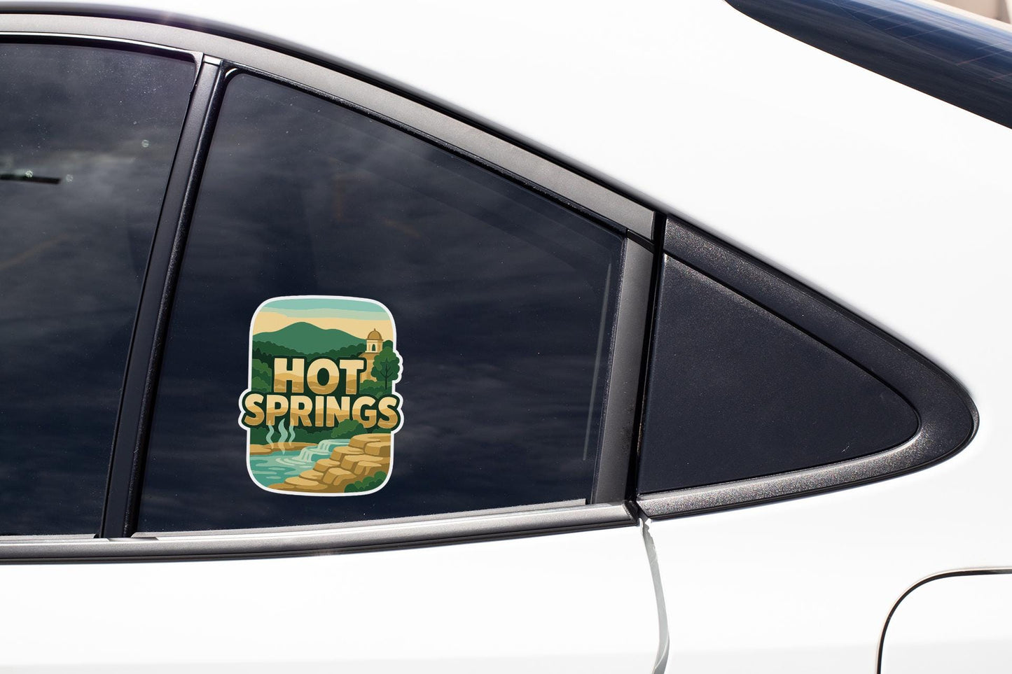 A sticker on the side of a car window that says "Hot Springs".