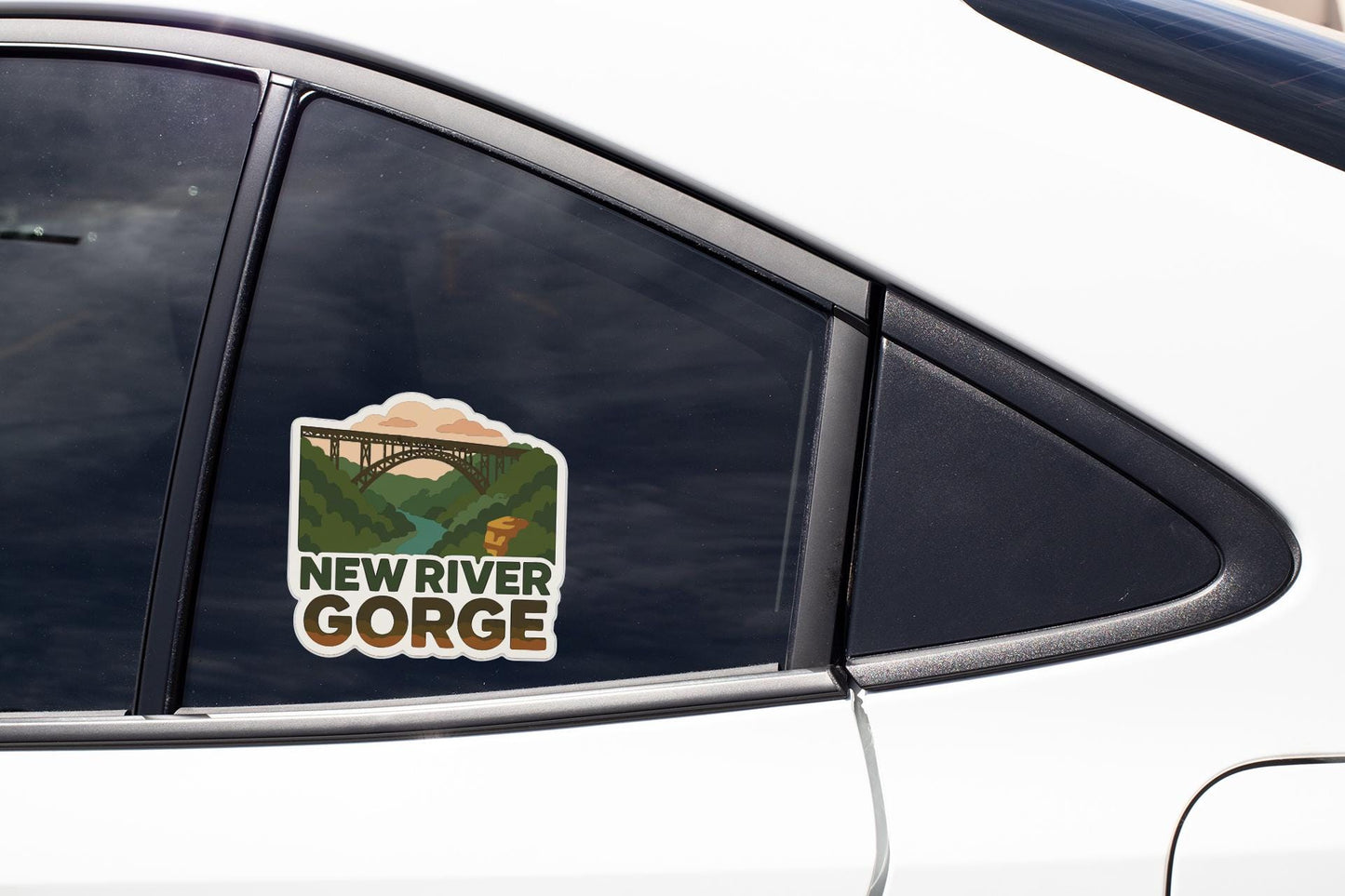 A sticker on the side of a car window that says "NEW RIVER GORGE".