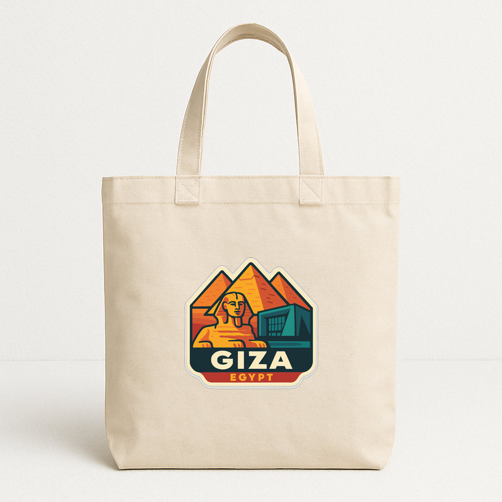A beige tote bag with a graphic design featuring a stylized illustration of the Great Sphinx of Giza, a famous landmark in Egypt.