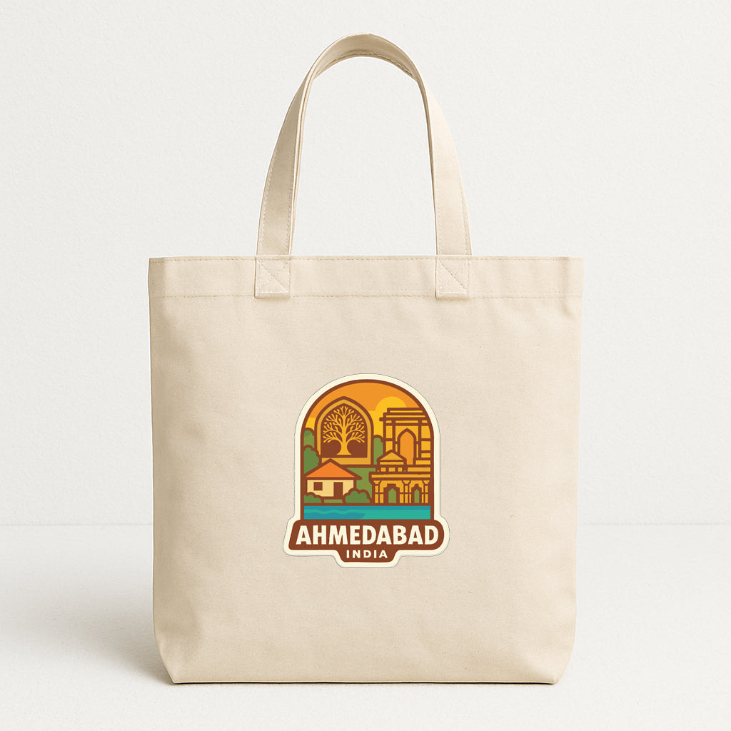 A beige tote bag with a graphic design depicting the city of Ahmedabad, India.