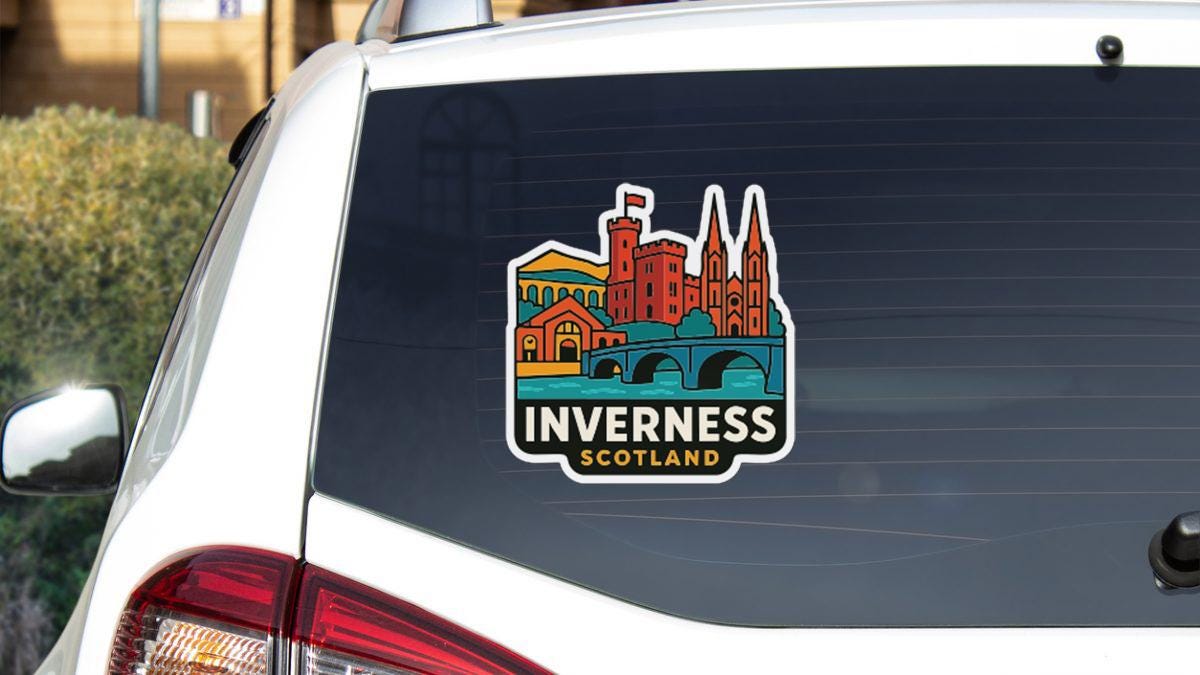 A sticker on the rear window of a vehicle, depicting a cityscape with a castle-like structure.