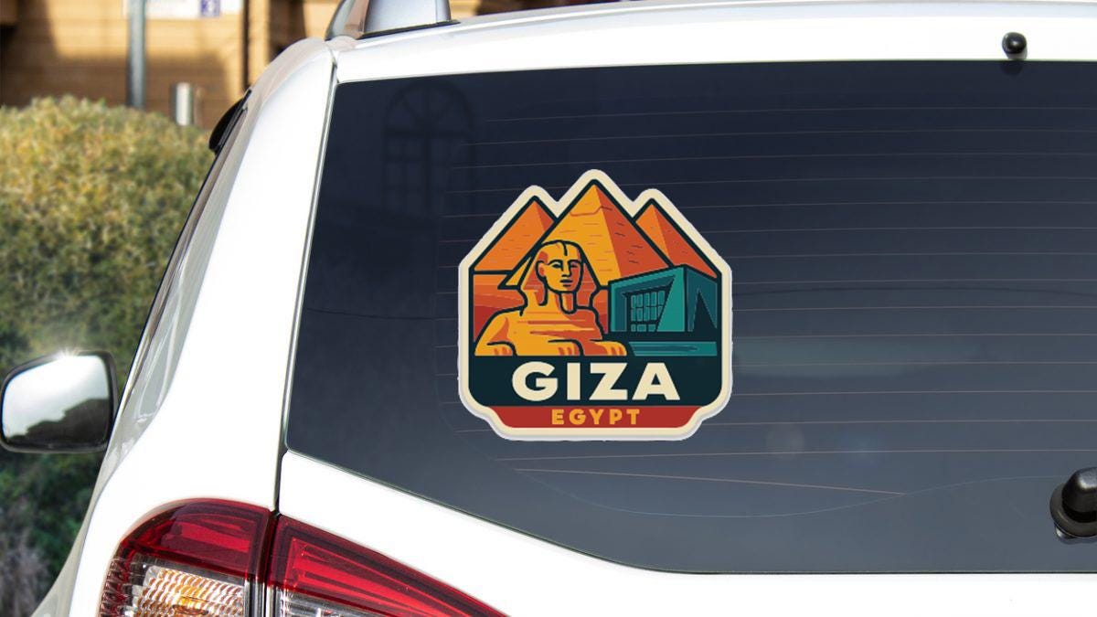 A sticker on the rear window of a car, featuring an illustration of the Great Sphinx of Giza, with the text "Giza Egypt" below it.