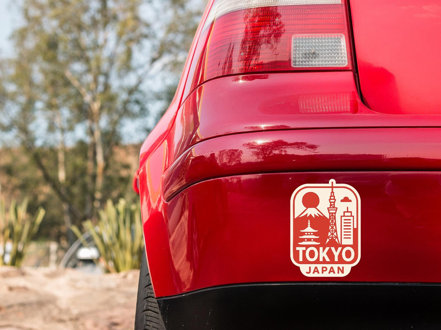 a close up of the back of a red car