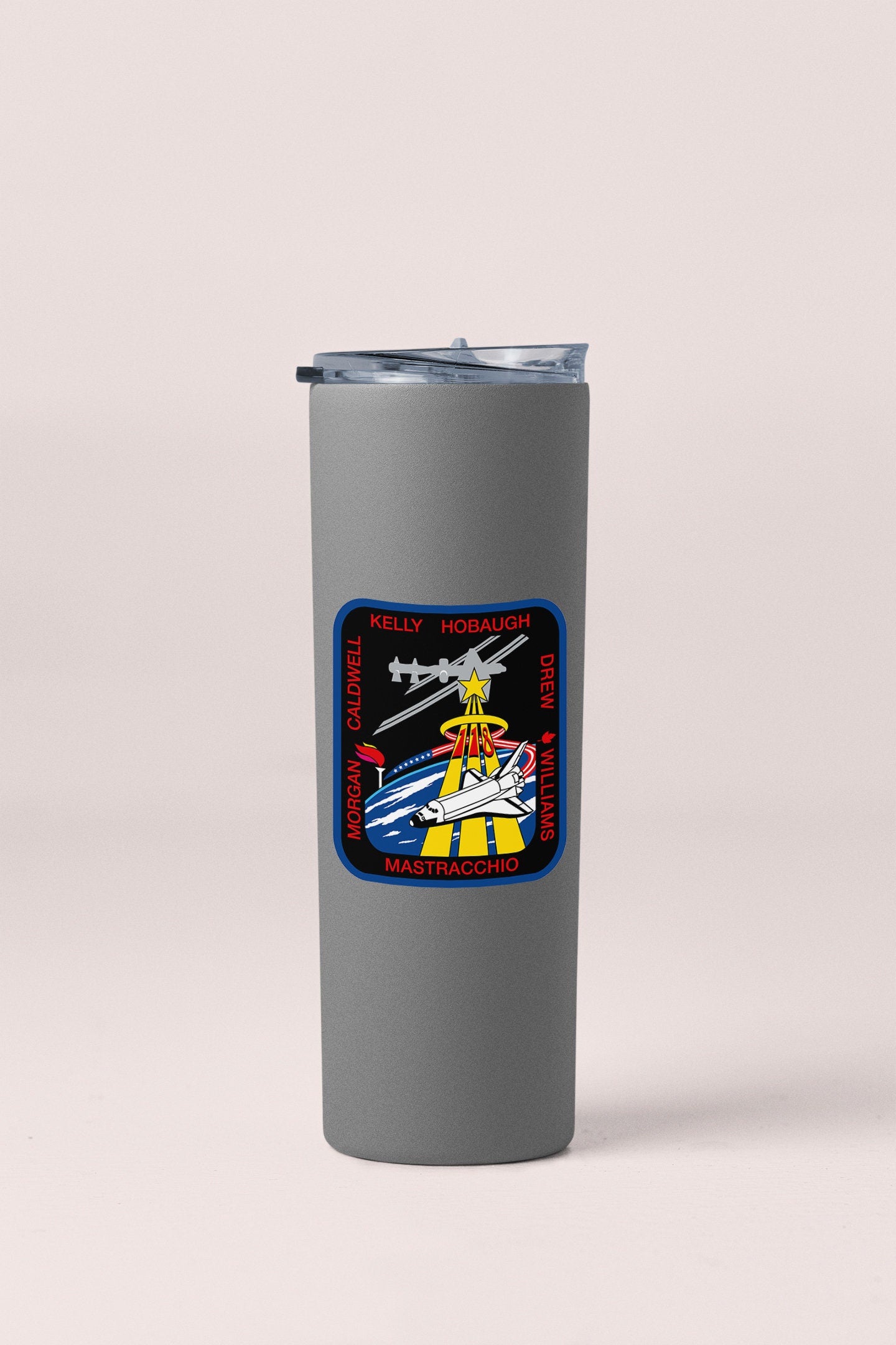 a travel mug with a picture of a plane on it