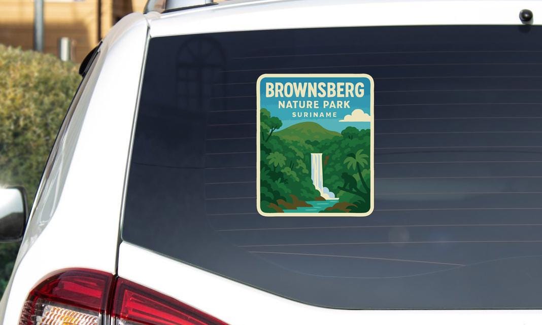 A sticker on the rear window of a car that says "Brownsberg Nature Park Suriname".