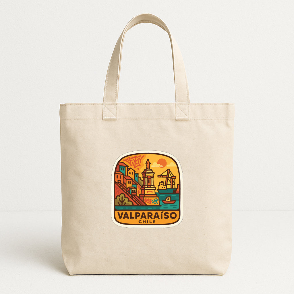 A beige tote bag with a colorful graphic depicting a cityscape and the text "VALPARAISO CHILE" printed on it.