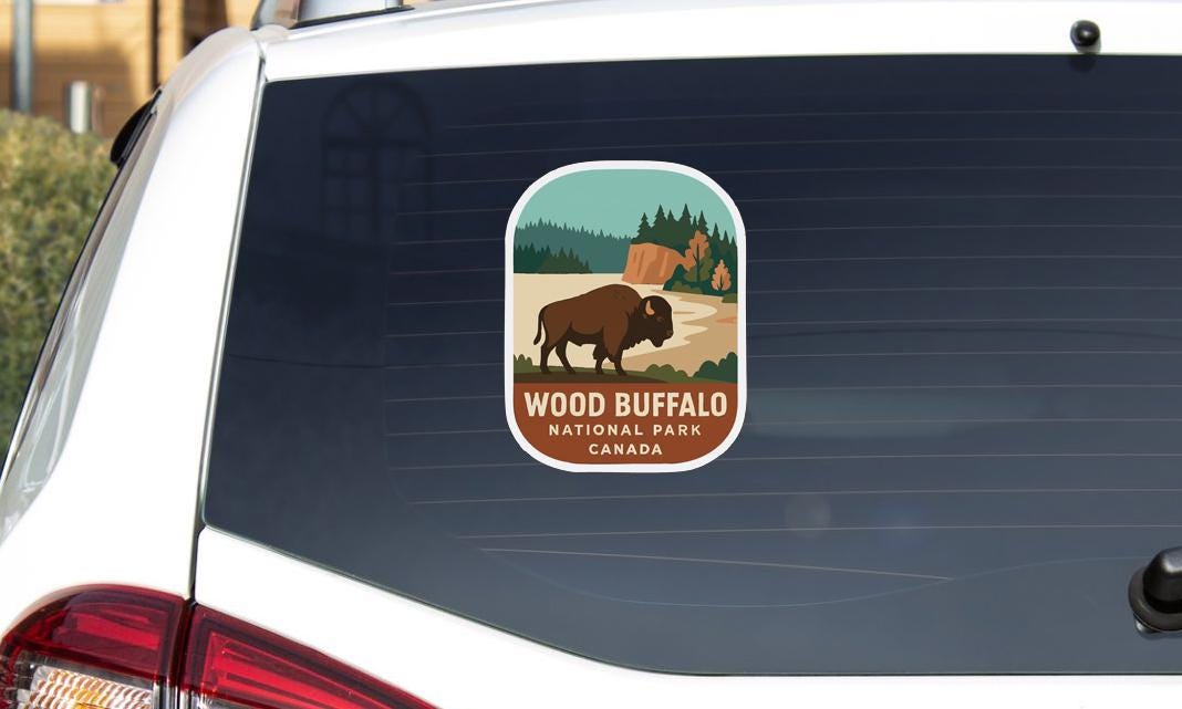 A sticker on the rear window of a car that says "Wood Buffalo National Park Canada".