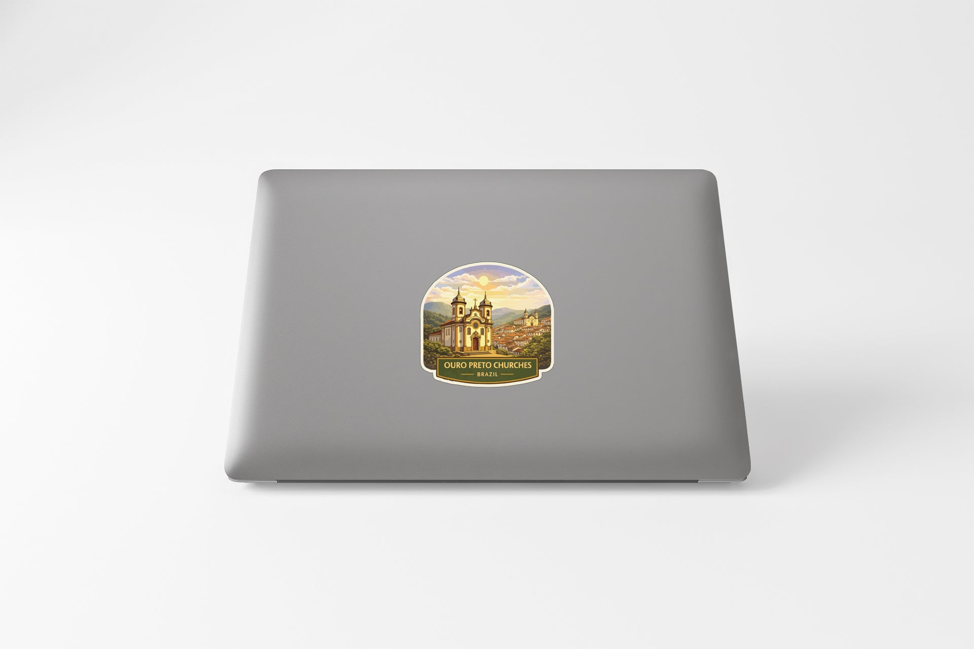 a sticker on the back of a laptop, depicting a castle or palace-like structure.