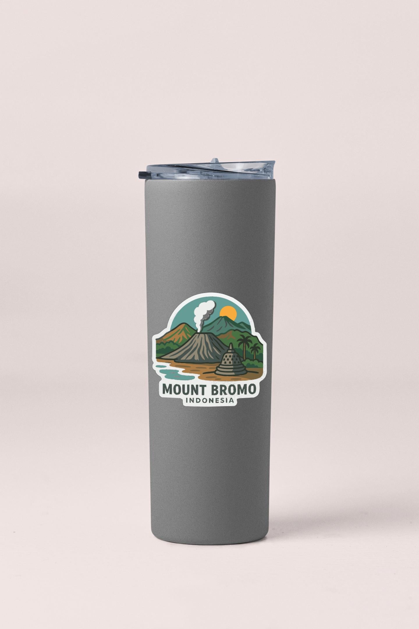 A gray insulated tumbler with a sticker depicting a mountain landscape and the text "Mount Bromo Indonesia".