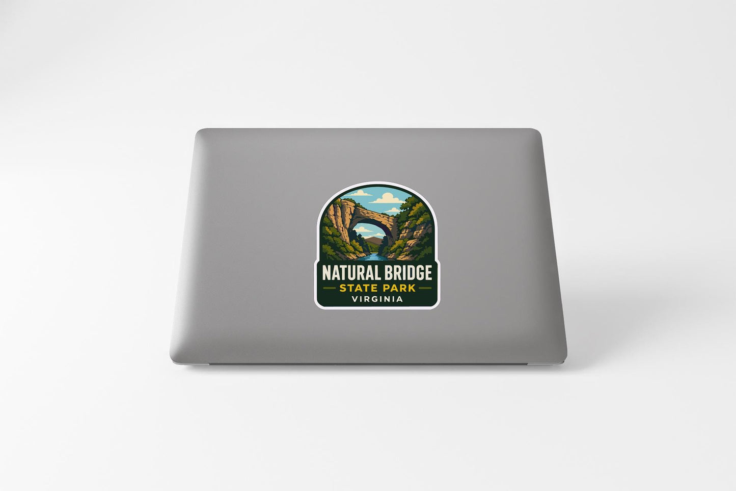 a sticker or decal of the Natural Bridge State Park in Virginia on the back of a laptop computer.