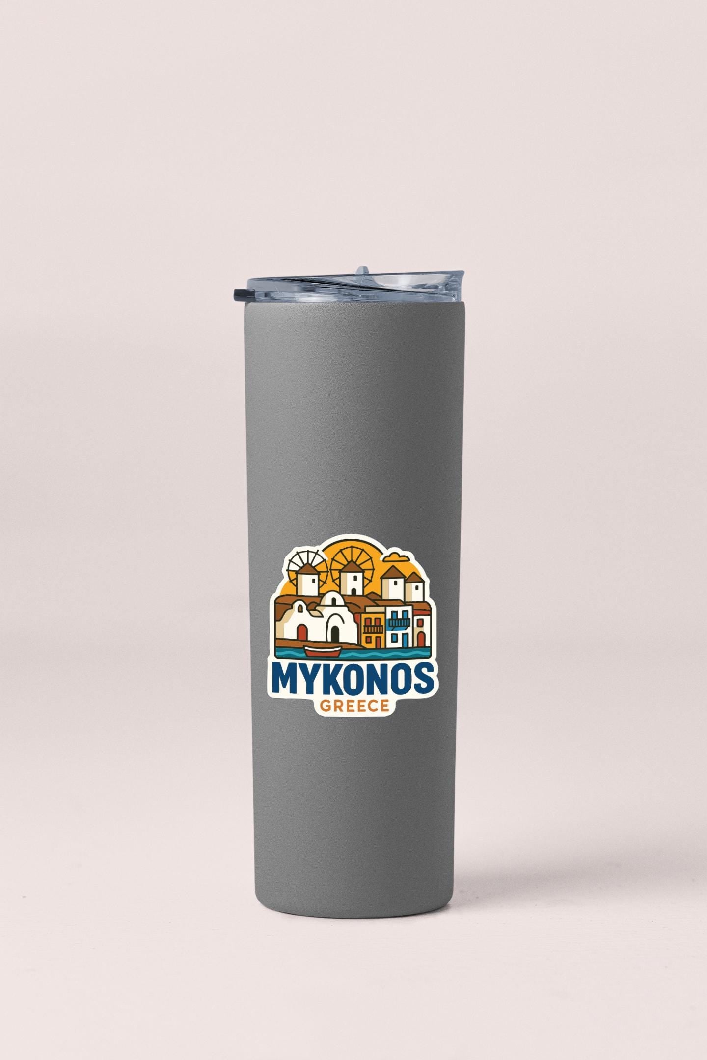 A gray insulated tumbler with a graphic design depicting the city of Mykonos, Greece.