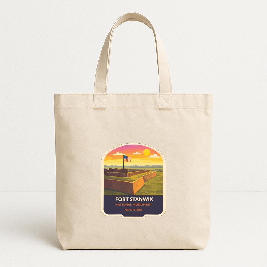 A beige tote bag with a printed label that says "FORT STANWIX NEW YORK".
