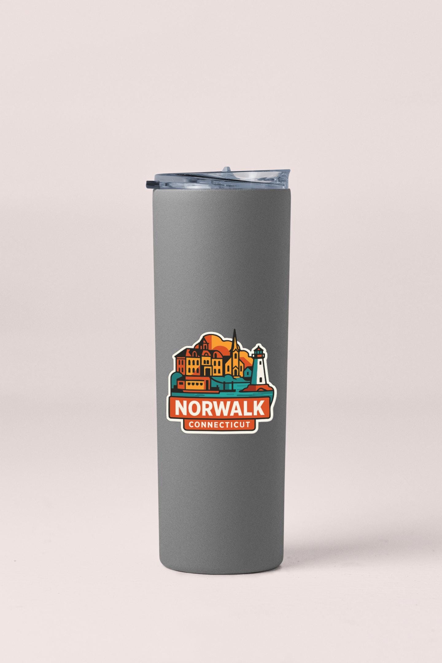 A gray insulated tumbler with a lid and a colorful sticker depicting a cityscape and the text "NORWALK CONNECTICUT".