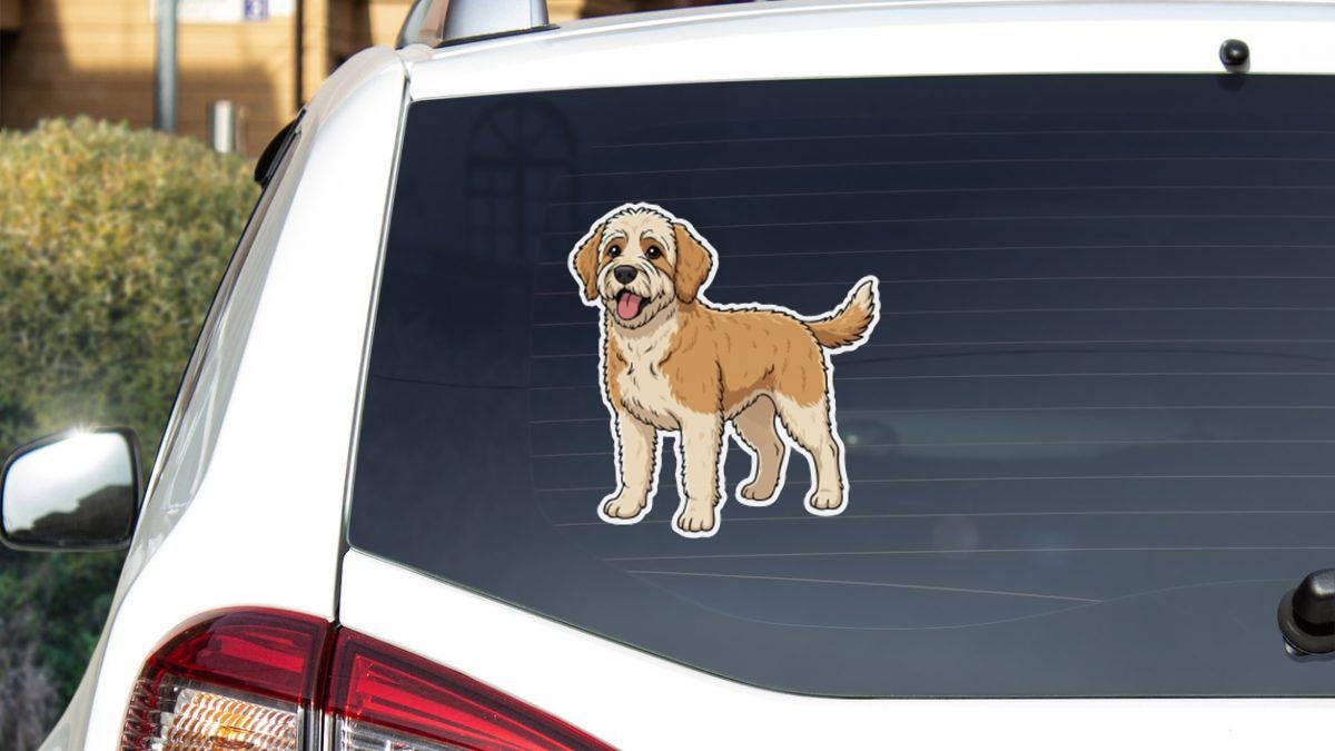 a cartoon dog sticker on the rear window of a white car.