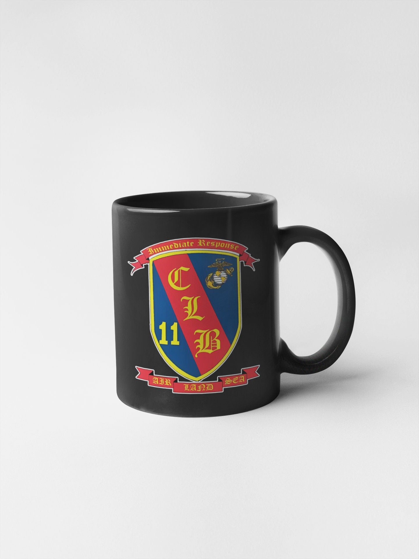 a black coffee mug with a coat of arms on it