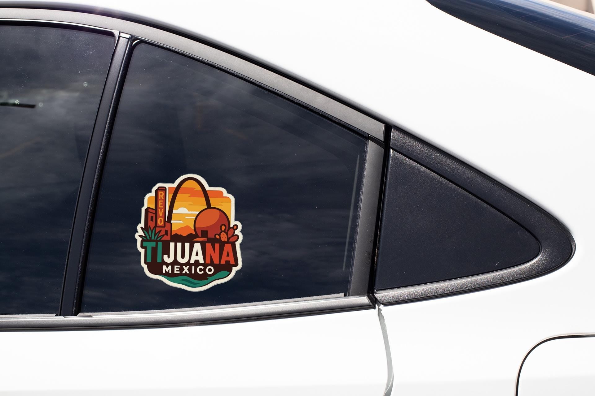 A sticker on the side of a car window that says "TJUANA MEXICO".