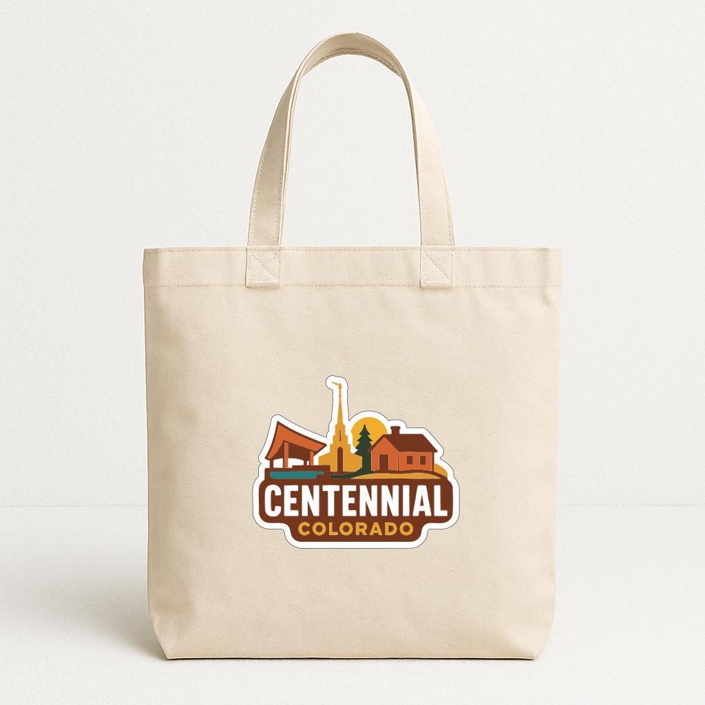 A beige tote bag with a logo that says "CENTENNIAL COLORADO".