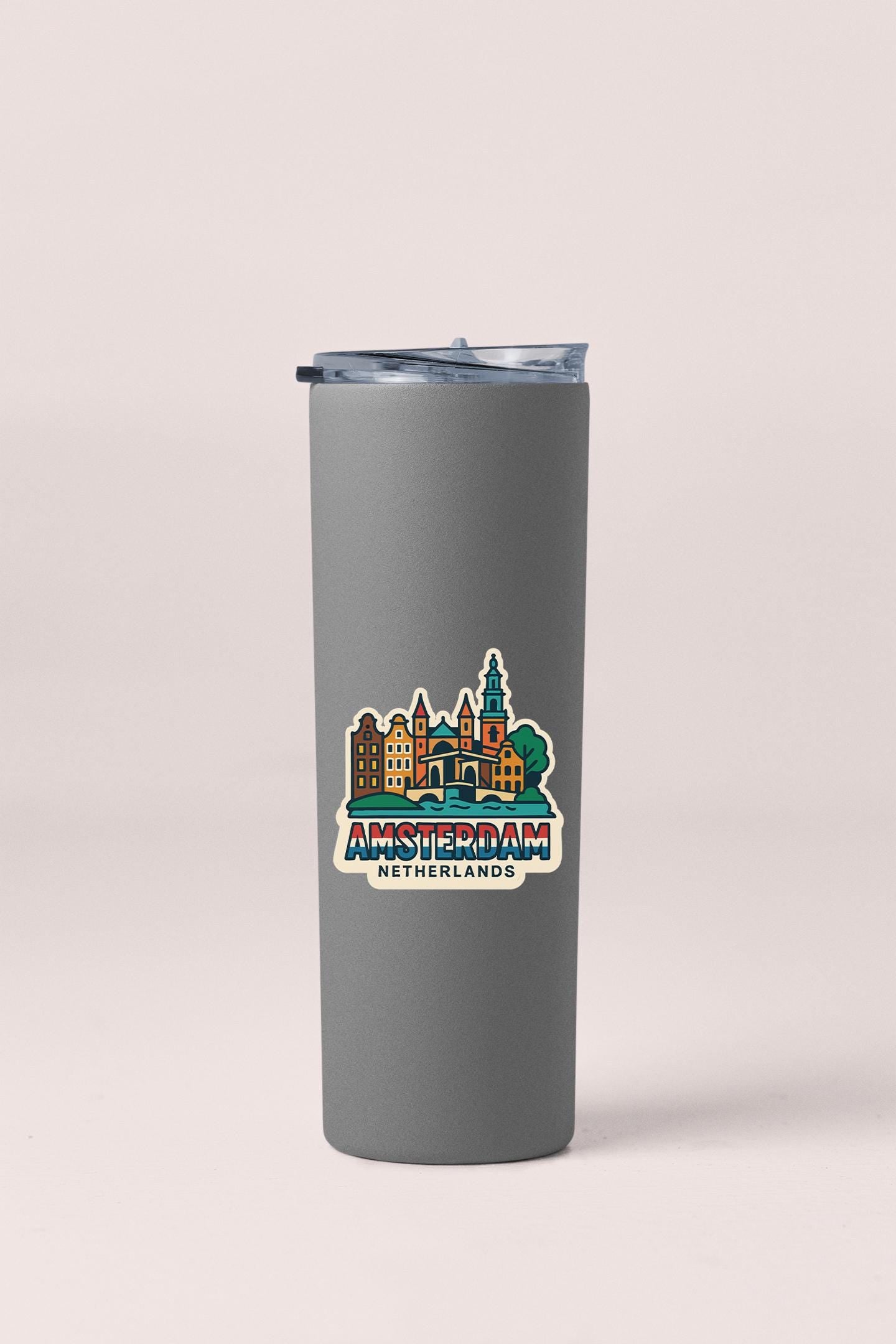 a travel mug with a city skyline on it