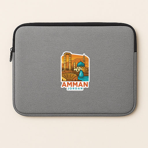 a gray laptop sleeve with a sticker depicting a city skyline and the text "AMMAN JORDAN".