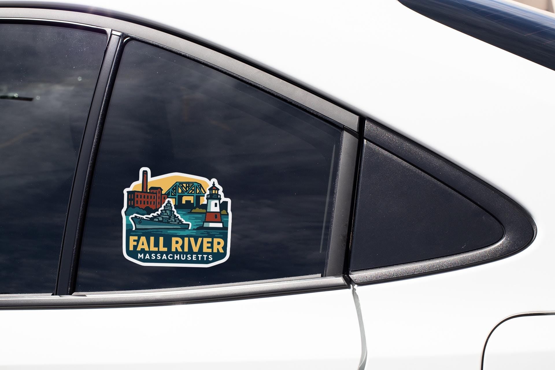 A sticker on the side of a car window, depicting a scenic view of the Fall River, Massachusetts.