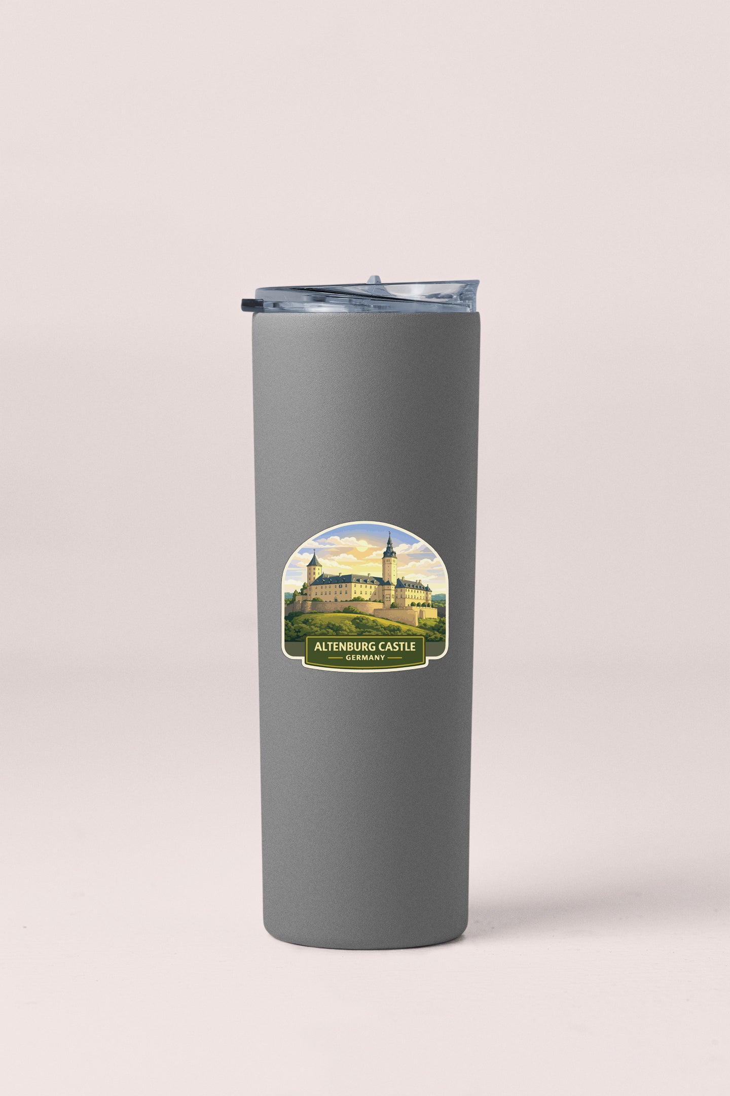 A gray insulated tumbler with a label that features an illustration of the Altenburg Castle in Germany.