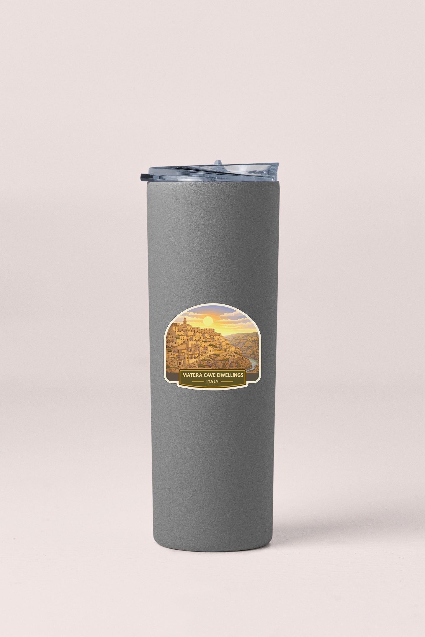A gray insulated tumbler with a label that says "Matteca cave dwelling Italy".
