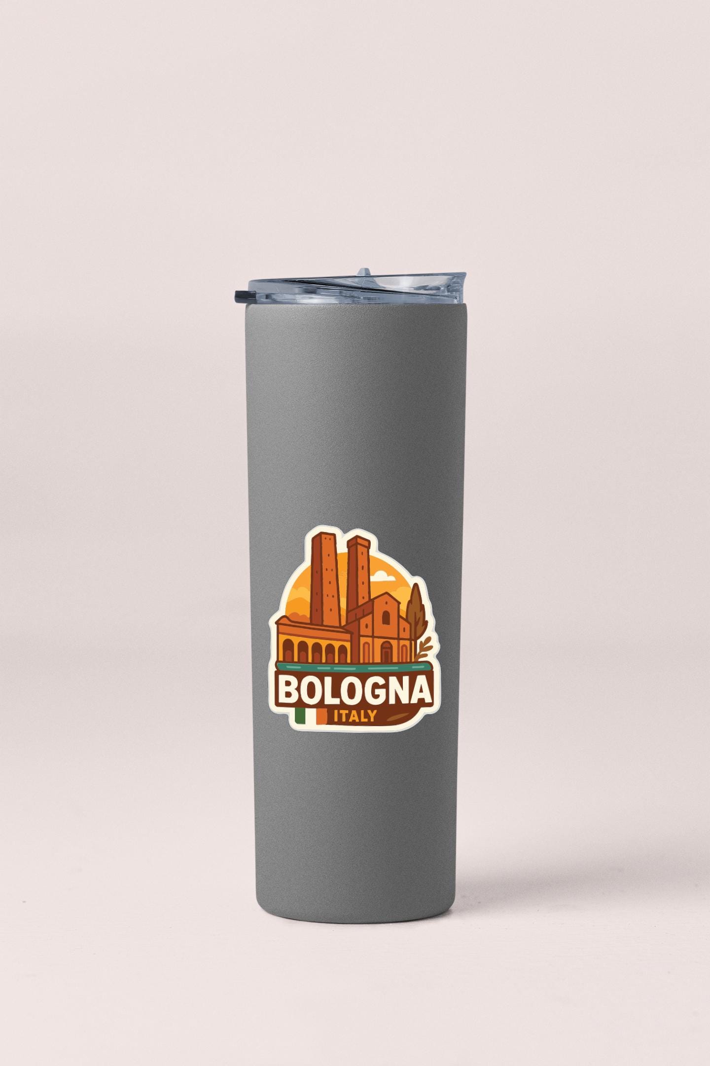 A gray insulated tumbler with a sticker depicting the city of Bologna, Italy.
