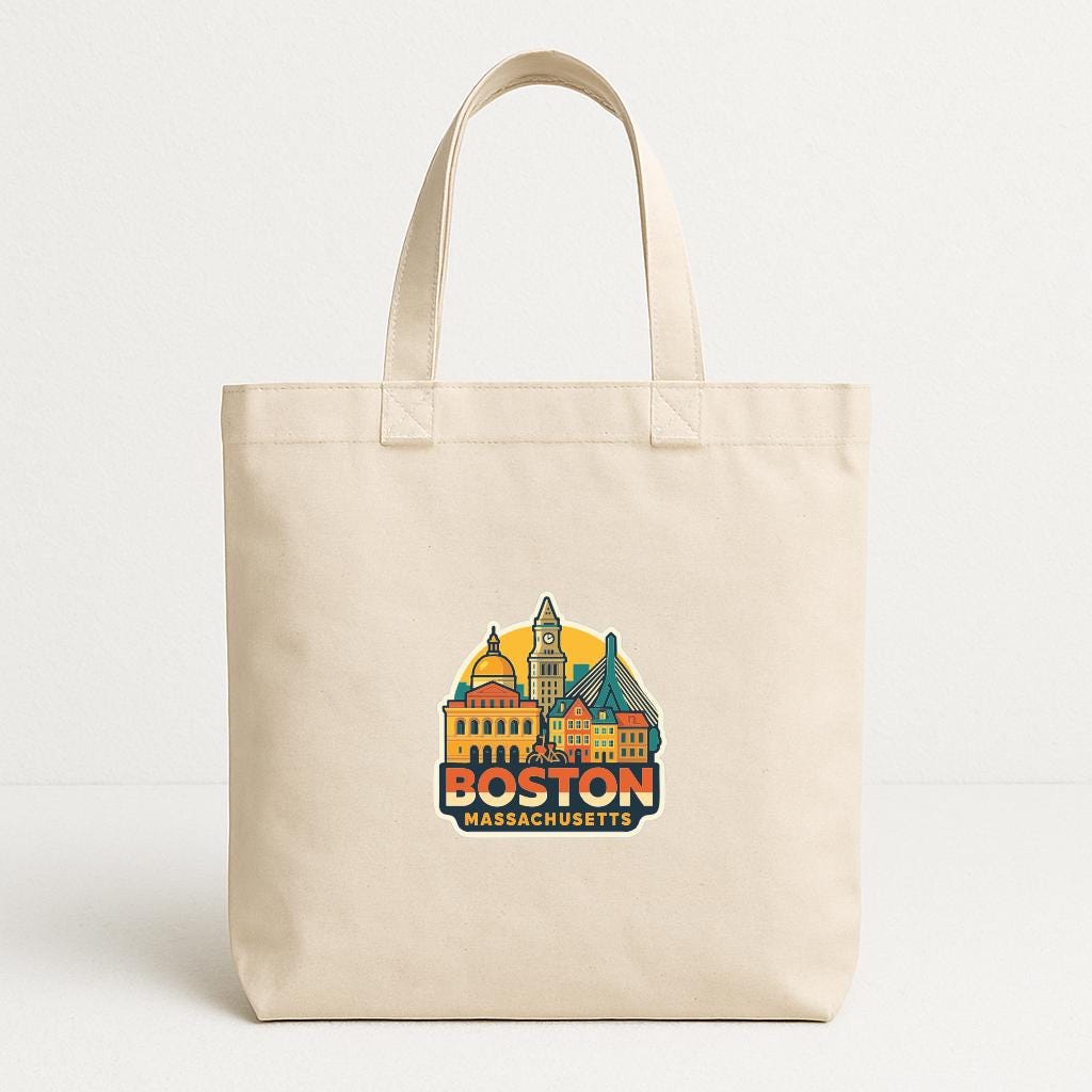 A beige tote bag with a graphic of the Boston skyline and the text "BOSTON MASSACHUSETTS" printed on it.
